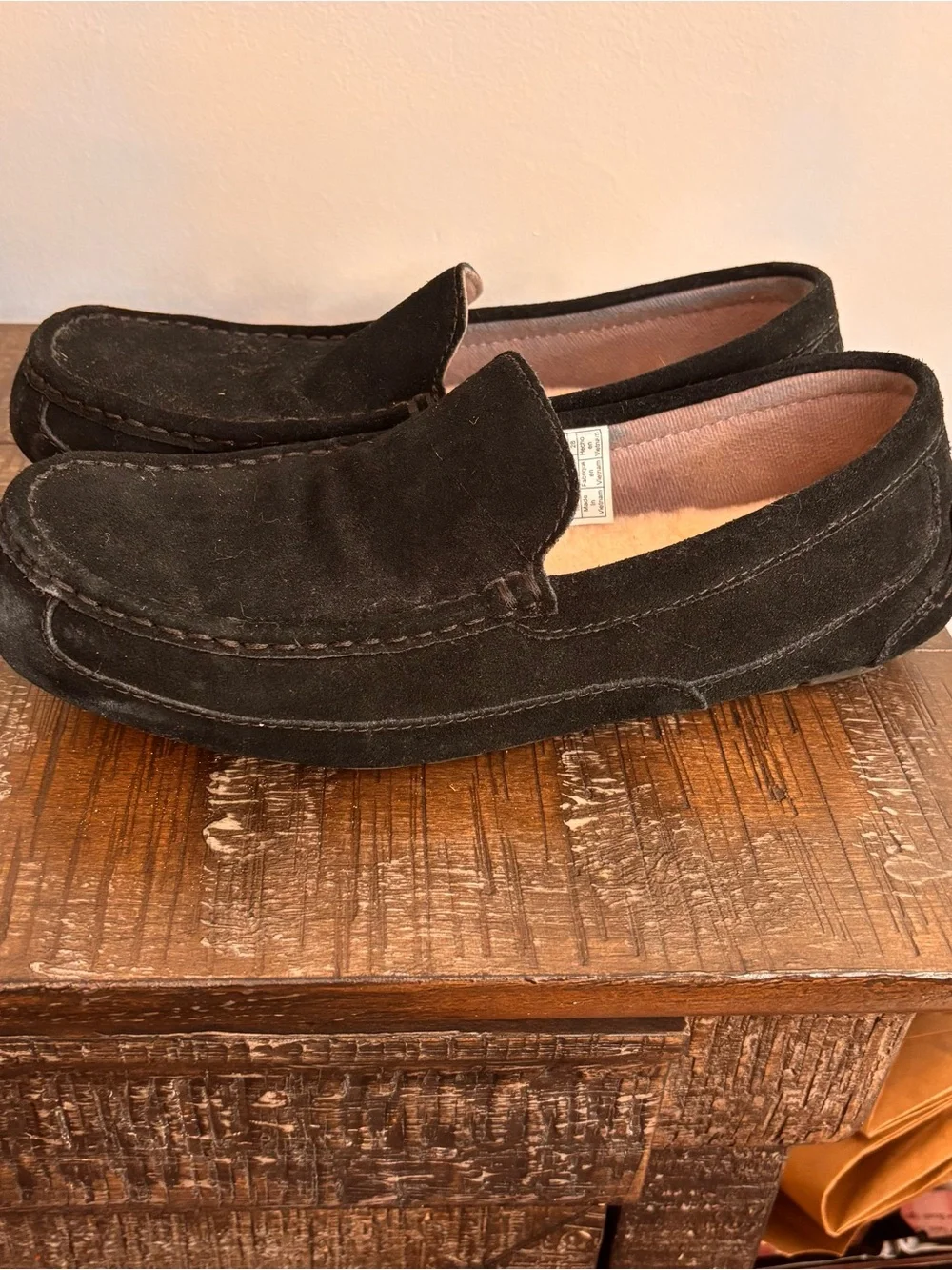 UGG Men's 10 Alder slippers crafted in black suede with a classic moc-toe stitch